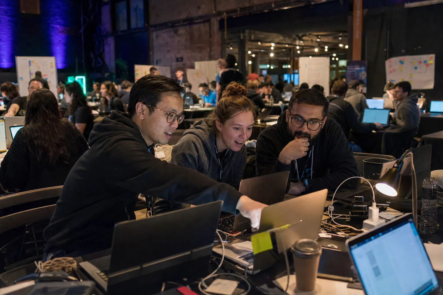 Builders working together late at a hackathon